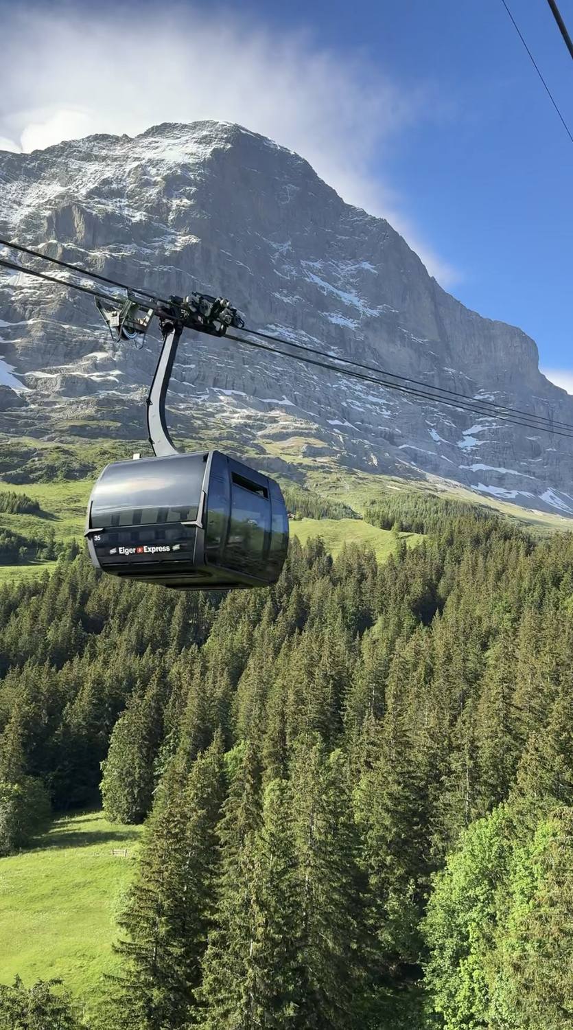 The Eiger north face above Grindelwald with an Eiger Express gondola on its cable