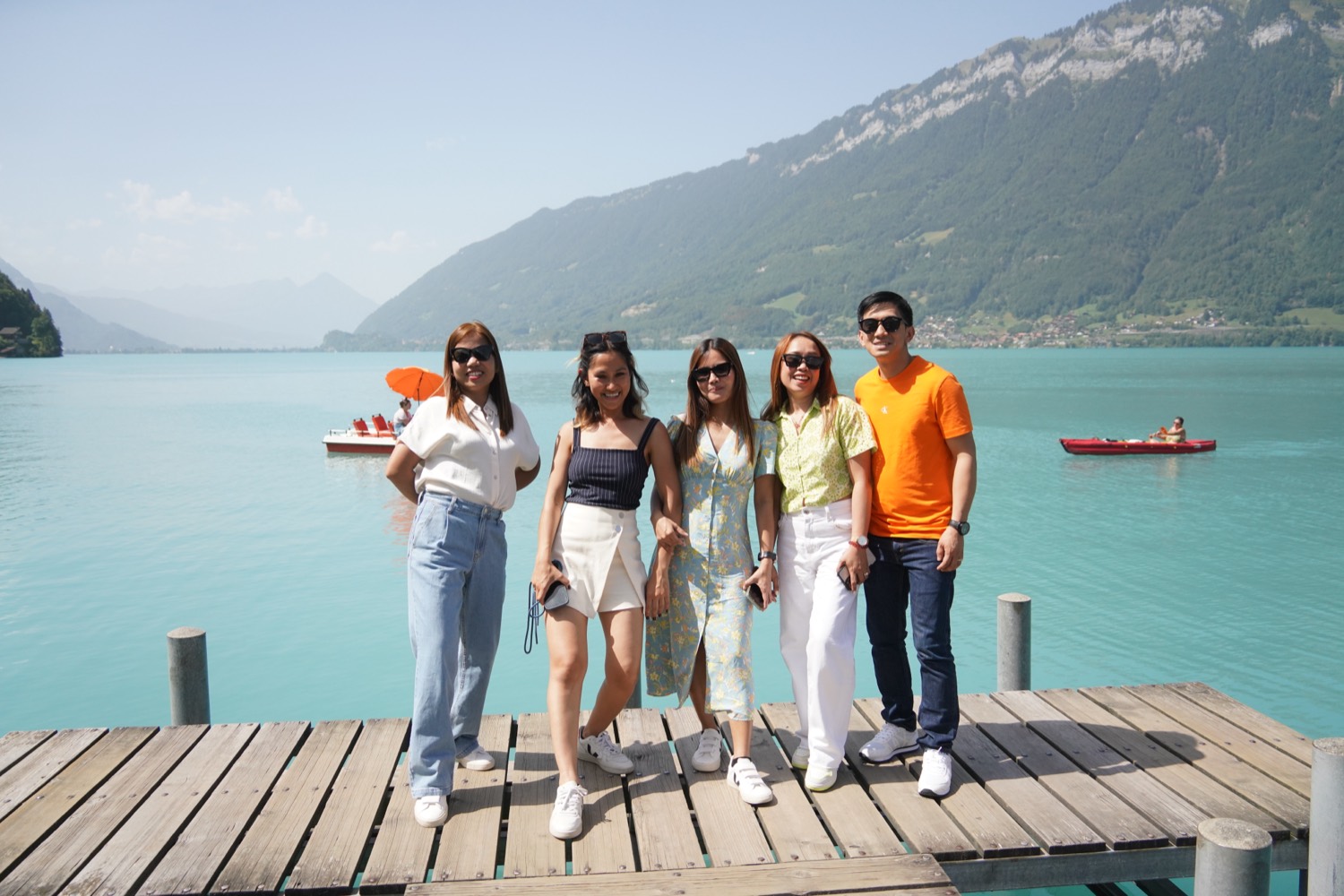 A family on the wooden pier in Iseltwald on Lake Brienz