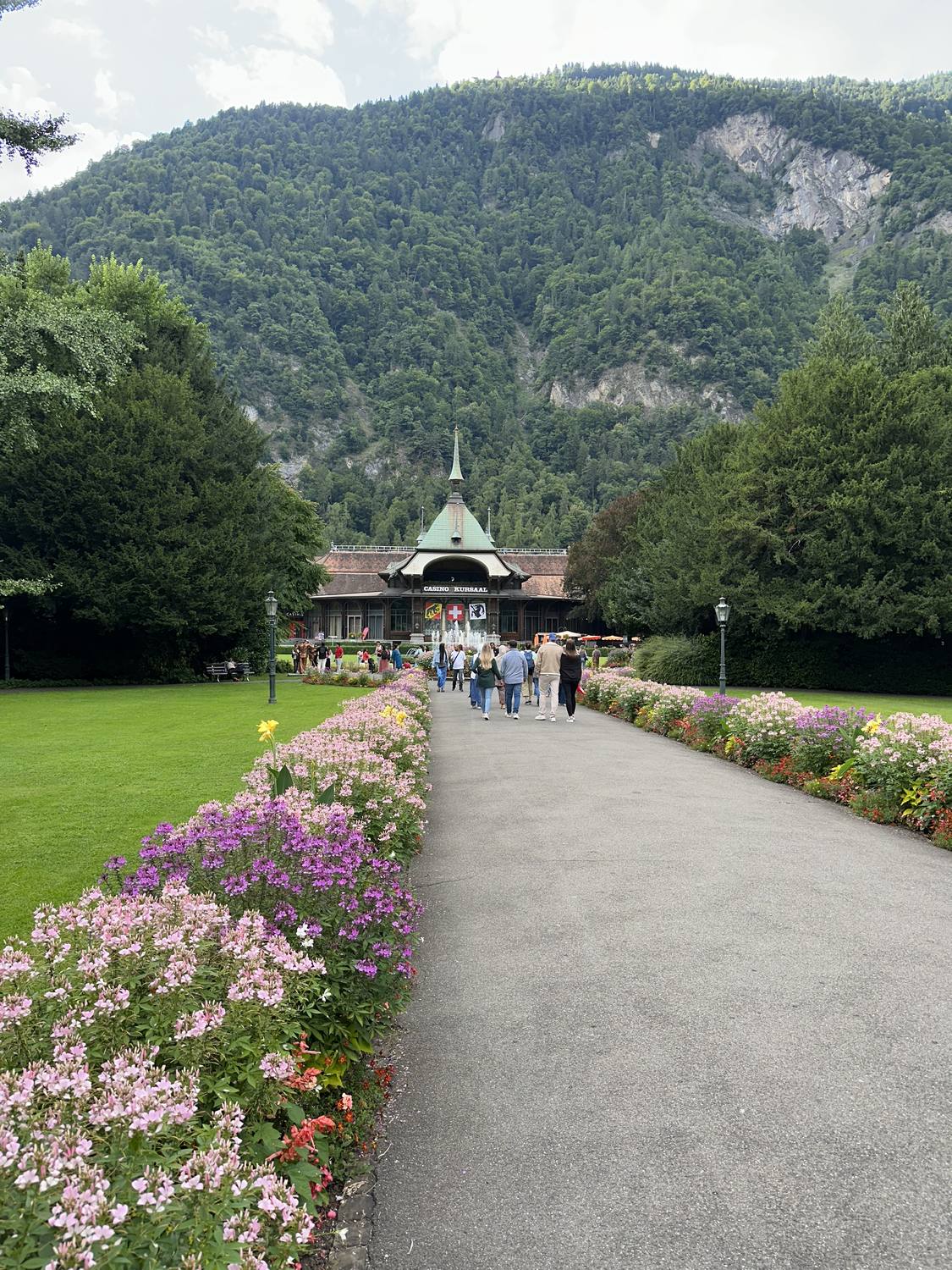 The flower-lined path across the Höhematte park in Interlaken, leading to the Kursaal