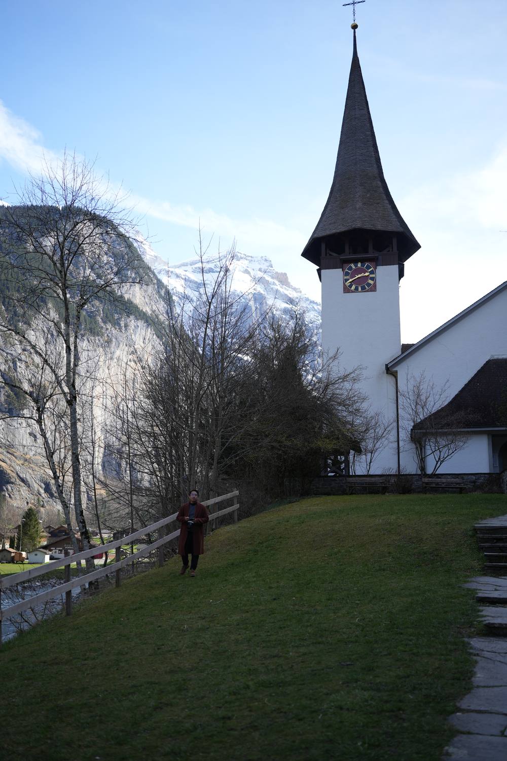 The church of Lauterbrunnen below the valley's rock walls in early spring