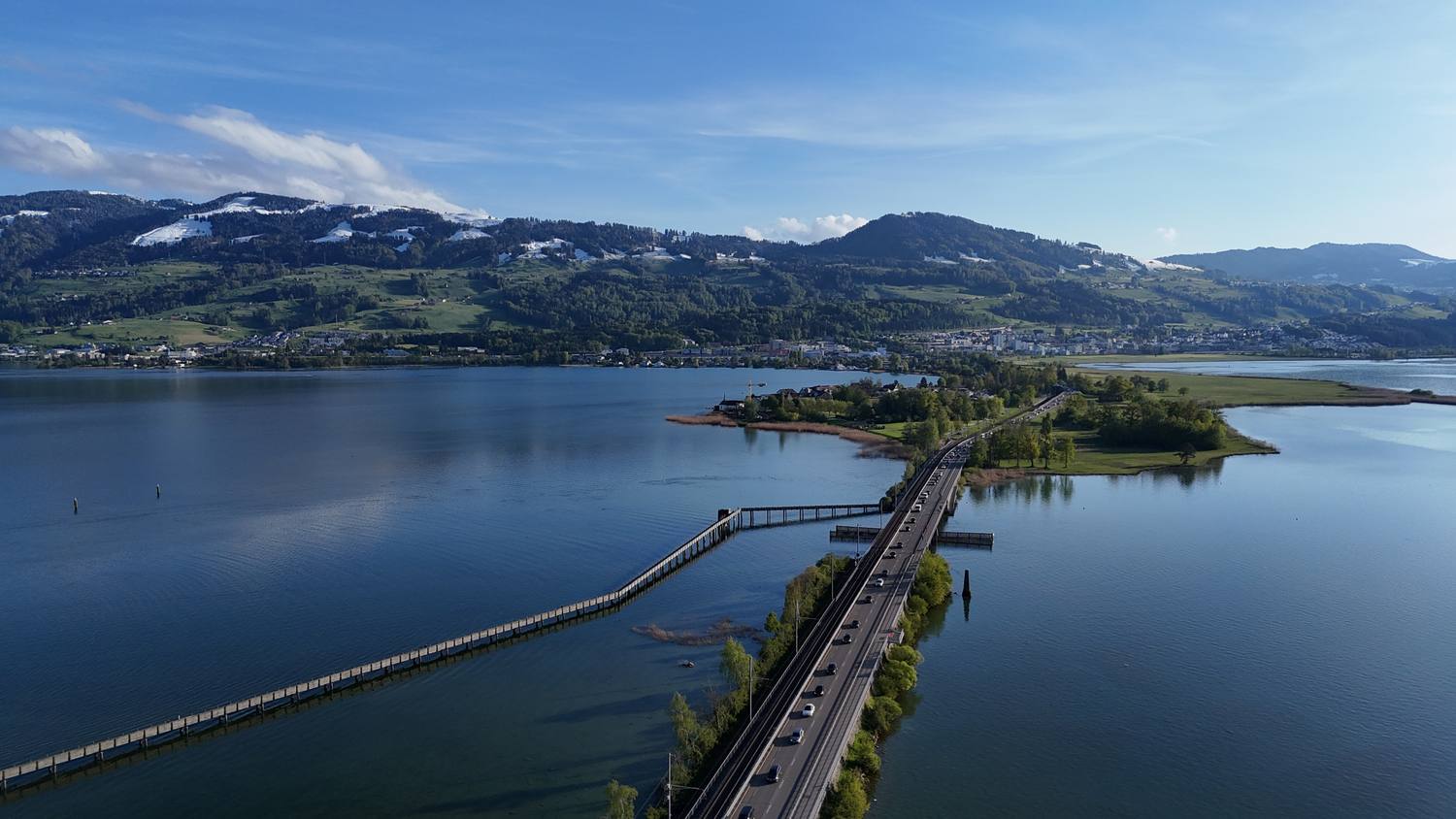 Upper Lake Zurich at Rapperswil with the Seedamm causeway and the wooden footbridge to Hurden, seen from the air