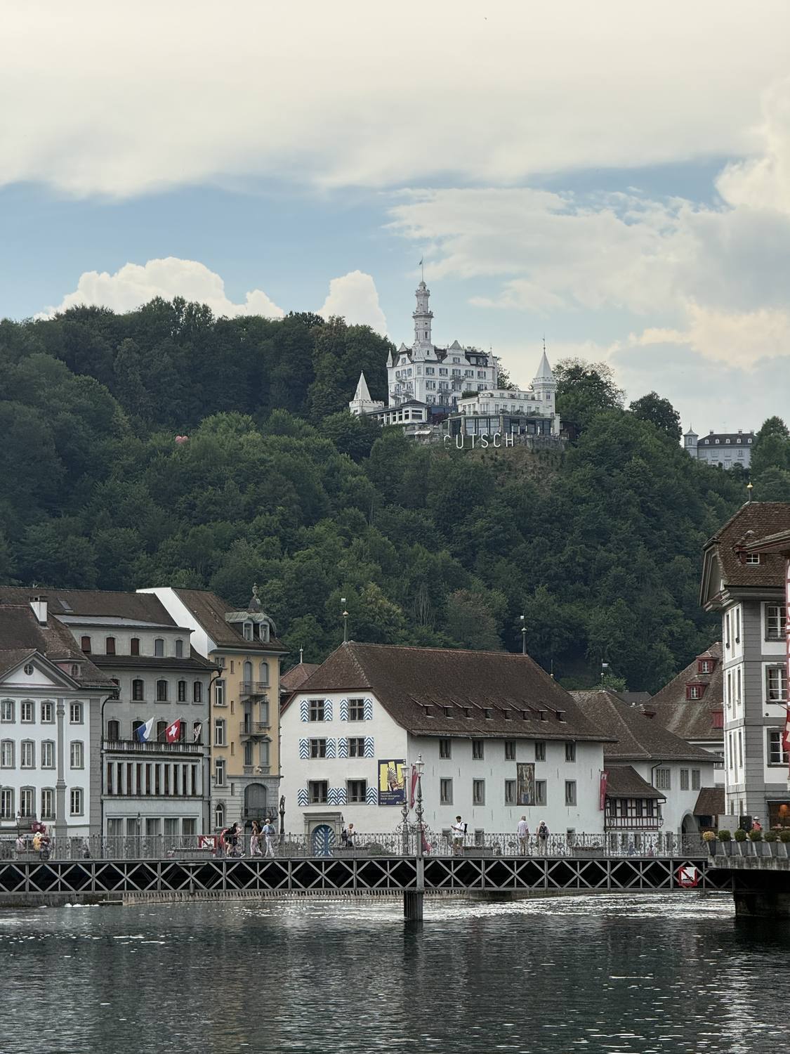 Chateau Guetsch on its wooded hill above the Reuss in Lucerne