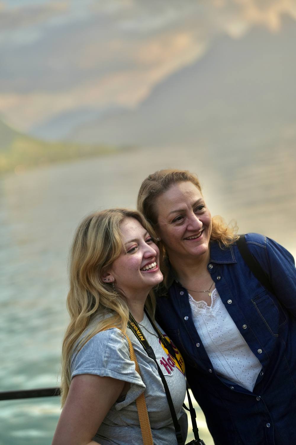 Two guests at the shore of Lake Lucerne in Küssnacht at dusk