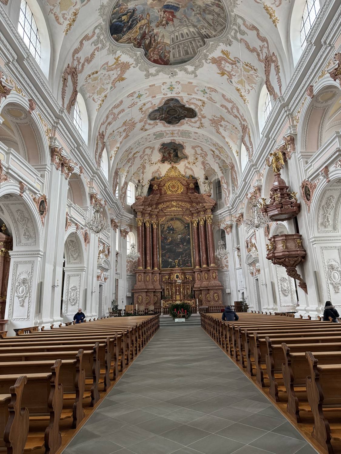 The white and gold baroque nave of the Jesuit Church in Lucerne