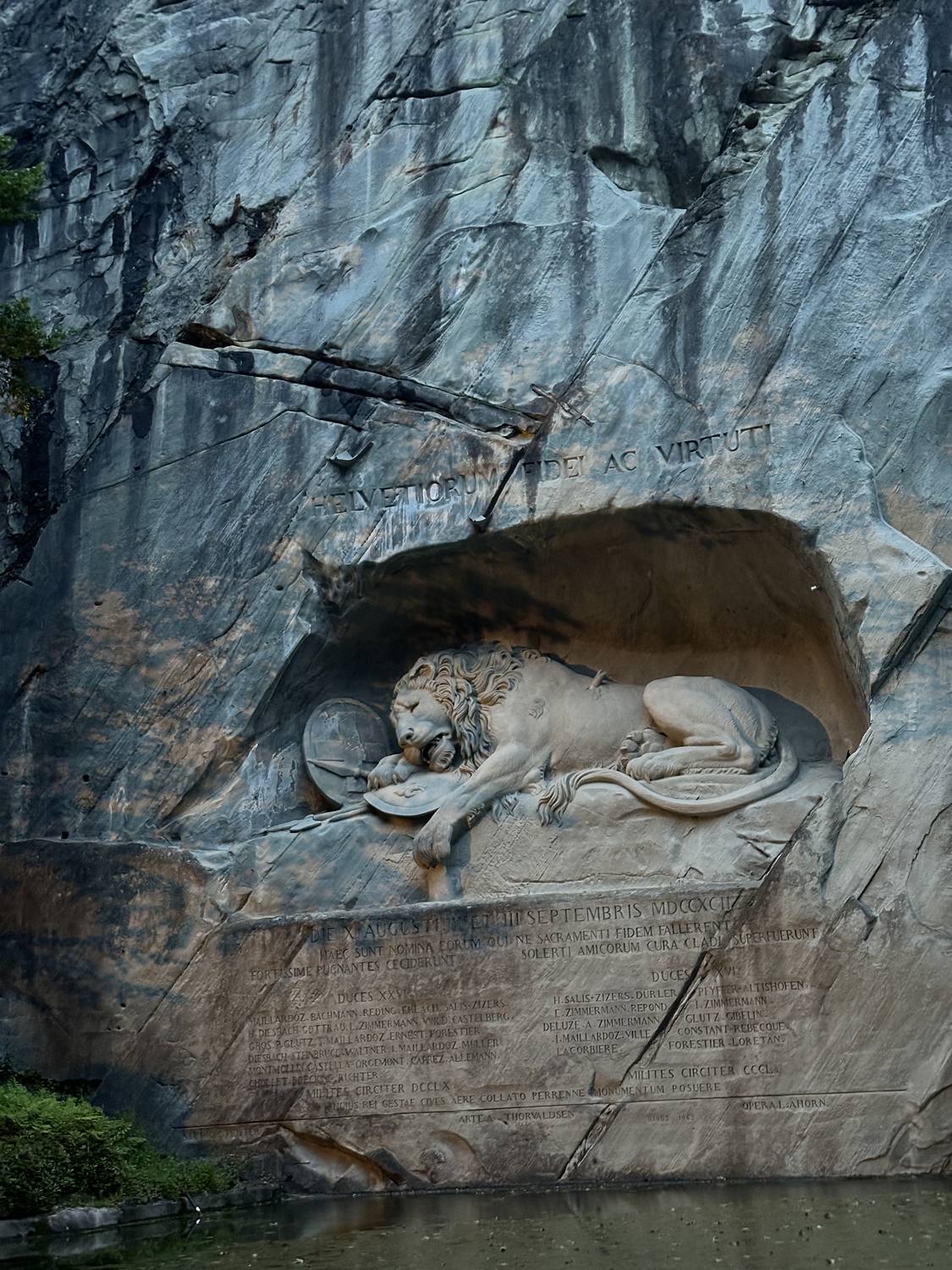 The dying lion of Lucerne close up, the inscription carved below him