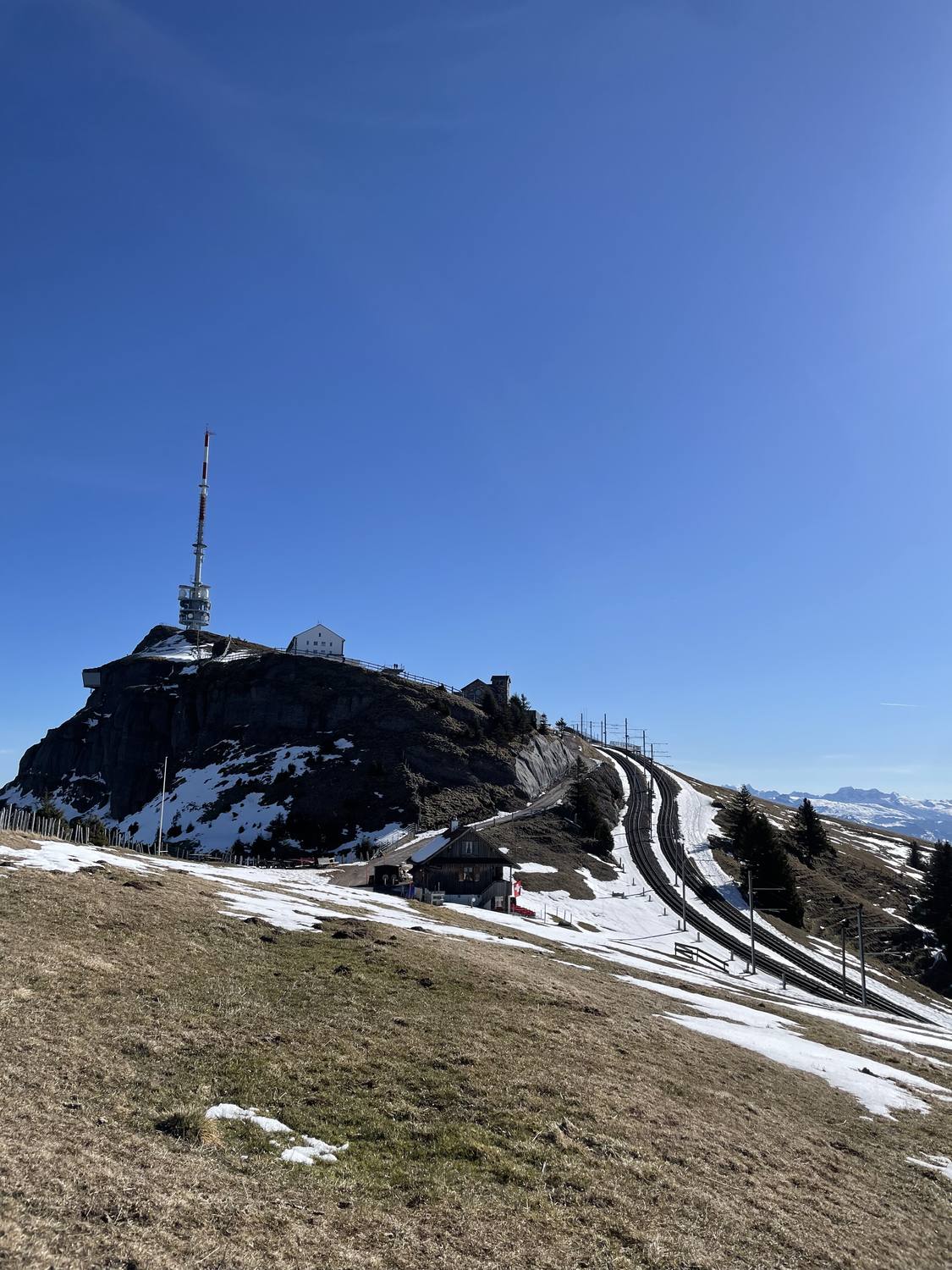 The summit of Rigi Kulm with its station and the cogwheel track climbing the ridge