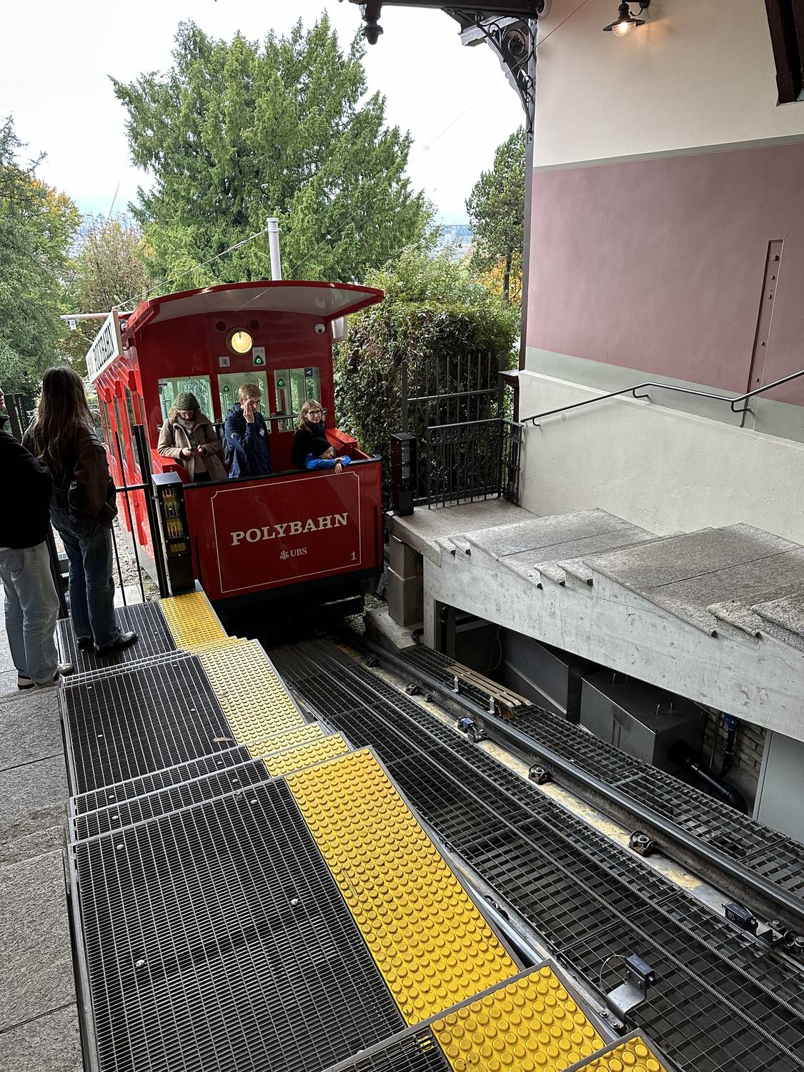 The red Polybahn funicular waiting at its station in Zurich