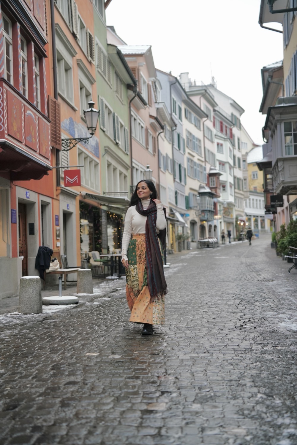 A guest walking through Augustinergasse in Zurich's old town